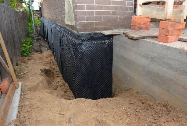 SJ Waterproofing Pros technician performing targeted Waterproofing assessment in Charlotte Hall, MD